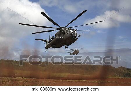 A CH-53E Super Stallion helicopter lands at the Kahuku Training Area, Hawaii. View Large Photo Image Picture - A CH-53E Super Stallion helicopter lands at the Kahuku Training Area, Hawaii.. Fotosearch