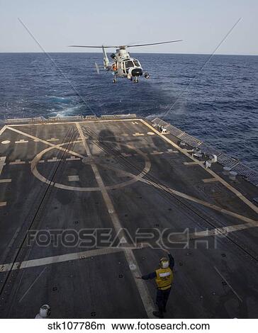 A Chinese Harbin Z-9C helicopter lands aboard USS Mason. View Large Photo Image Picture - A Chinese Harbin Z-9C helicopter lands aboard USS Mason.. Fotosearch