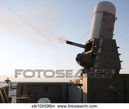 A close-in weapons system fires a burst of tungsten rounds. View Large Photo Image Picture - A close-in weapons system fires a burst of tungsten rounds.. Fotosearch