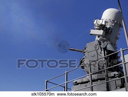 A Close-In Weapons System is fired aboard USS Bunker Hill. View Large Photo Image Picture - A Close-In Weapons System is fired aboard USS Bunker Hill.. Fotosearch