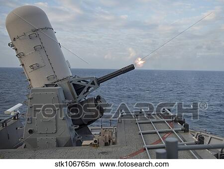 A close-in weapons system is fired aboard USS Tortuga. View Large Photo Image Picture - A close-in weapons system is fired aboard USS Tortuga.. Fotosearch