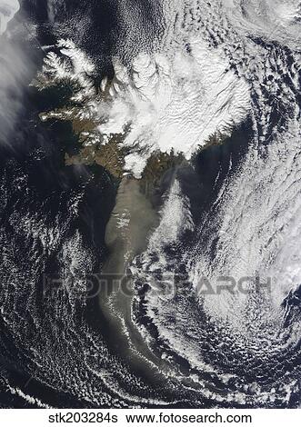 Stock Photograph - A cloud of ash from Iceland's Eyjafjallajokull volcano extends over the ocean.. Fotosearch