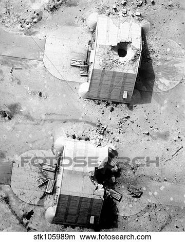 A coalition bombing of aircraft hangers during Operation Desert Storm. View Large Photo Image Picture - A coalition bombing of aircraft hangers during Operation Desert Storm.. Fotosearch