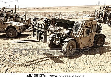 Picture - A Combat Logistics Battalion multi-mission vehicle unloads supplies.. Fotosearch