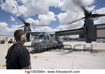 A crew chief watches as a CV-22 Osprey performs preflight checks. View Large Photo Image Picture - A crew chief watches as a CV-22 Osprey performs preflight checks.. Fotosearch