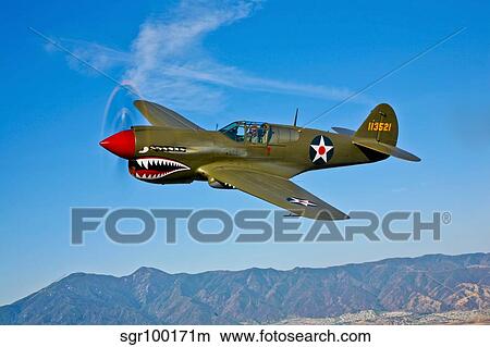 A Curtiss P-40E Warhawk in flight near Chino, California. View Large Photo Image Picture - A Curtiss P-40E Warhawk in flight near Chino, California.. Fotosearch