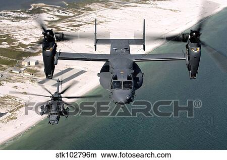 A CV-22 Osprey and an MH-53 Pave Low fly over the coastline of Florida. View Large Photo Image Picture - A CV-22 Osprey and an MH-53 Pave Low fly over the coastline of Florida.. Fotosearch