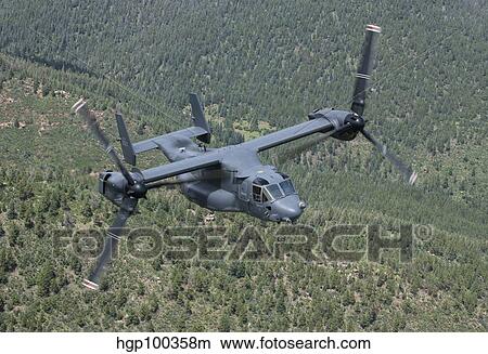 A CV-22 Osprey on a training mission over New Mexico. View Large Photo Image Picture - A CV-22 Osprey on a training mission over New Mexico.. Fotosearch