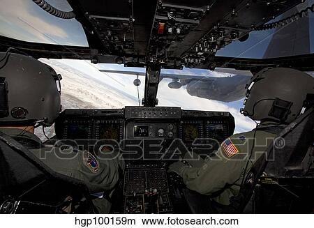 Picture - A CV-22 Osprey onducts aerial refueling with an HC-130 aircraft.. Fotosearch