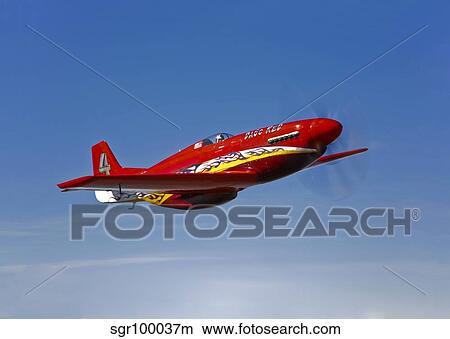 A Dago Red P-51G Mustang in flight. View Large Photo Image Picture - A Dago Red P-51G Mustang in flight.. Fotosearch