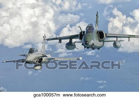 A Dassault Rafale of the French Air Force flys alongside an Embraer A-1B of the Brazilian Air Force. View Large Photo Image Picture - A Dassault Rafale of the French Air Force flys alongside an Embraer A-1B of the Brazilian Air Force.. Fotosearch