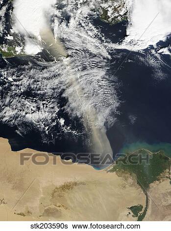 Stock Photograph - A dust plume stretches across the Mediterranean Sea.. Fotosearch