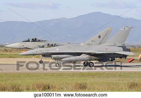 A Eurofighter 2000 Typhoon and a F-16ADF, both from the Italian Air Force. View Large Photo Image Picture - A Eurofighter 2000 Typhoon and a F-16ADF, both from the Italian Air Force.. Fotosearch