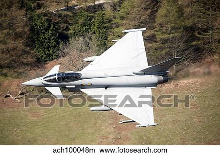 A Eurofighter Typhoon F2 aircraft of the Royal Air Force low flying over North Wales. View Large Photo Image Picture - A Eurofighter Typhoon F2 aircraft of the Royal Air Force low flying over North Wales.. Fotosearch