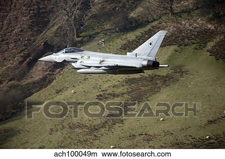 Picture - A Eurofighter Typhoon F2 aircraft of the Royal Air Force low flying in North Wales.. Fotosearch