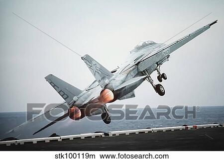A F-14A Tomcat aircraft is launched from the nuclear-powered aircraft carrier USS Theodore Roosevelt. View Large Photo Image Picture - A F-14A Tomcat aircraft is launched from the nuclear-powered aircraft carrier USS Theodore Roosevelt.. Fotosearch