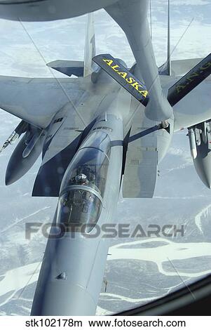 A F-15 Eagle receives fuel from a KC-135 Stratotanker. View Large Photo Image Picture - A F-15 Eagle receives fuel from a KC-135 Stratotanker.. Fotosearch