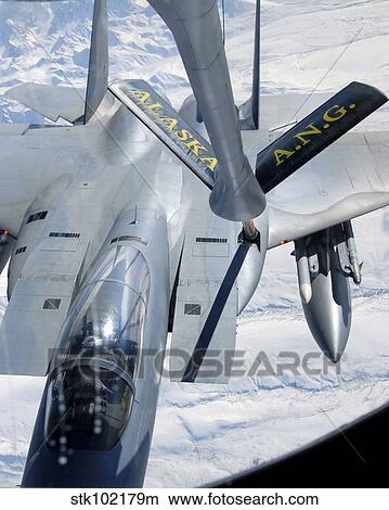 A F-15 Eagle refuels behind a KC-135 Stratotanker. View Large Photo Image Picture - A F-15 Eagle refuels behind a KC-135 Stratotanker.. Fotosearch