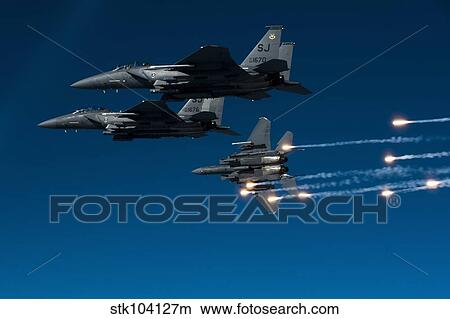 A F-15E Strike Eagle aircraft releases flares. View Large Photo Image Picture - A F-15E Strike Eagle aircraft releases flares.. Fotosearch
