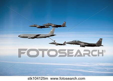 A F-15E Strike Eagle is refueled by a KC-135 Stratotanker. View Large Photo Image Picture - A F-15E Strike Eagle is refueled by a KC-135 Stratotanker.. Fotosearch