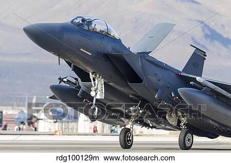 A F-15E Strike Eagle of the U. S. Air Force uses aero braking after landing. View Large Photo Image Picture - A F-15E Strike Eagle of the U. S. Air Force uses aero braking after landing.. Fotosearch
