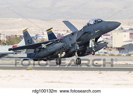 A F-15E Strike Eagle of the U. S. Air Force uses aero braking after landing. View Large Photo Image Picture - A F-15E Strike Eagle of the U. S. Air Force uses aero braking after landing.. Fotosearch