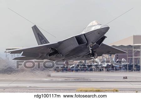 A F-22 Raptor of the U. S. Air Force launches from Nellis Air Force Base, Nevada. View Large Photo Image Picture - A F-22 Raptor of the U. S. Air Force launches from Nellis Air Force Base, Nevada.. Fotosearch