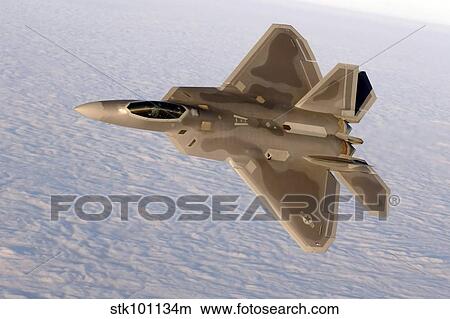 A F-22A Raptor aggressively banks. View Large Photo Image Picture - A F-22A Raptor aggressively banks.. Fotosearch