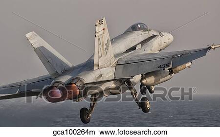 A F/A-18C Hornet taking off from USS George H. W. Bush. View Large Photo Image Picture - A F/A-18C Hornet taking off from USS George H. W. Bush.. Fotosearch