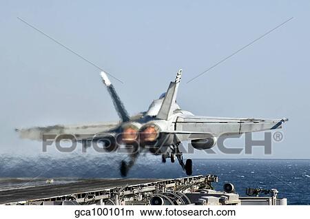 A F/A-18F Super Hornet launches from the flight deck of aircraft carrier USS Nimitz. View Large Photo Image Picture - A F/A-18F Super Hornet launches from the flight deck of aircraft carrier USS Nimitz.. Fotosearch