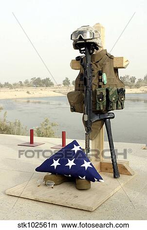 Picture - A fallen soldiers gear display.. Fotosearch