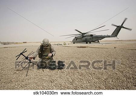 A field radio operator sets up satellite communication. View Large Photo Image Picture - A field radio operator sets up satellite communication.. Fotosearch