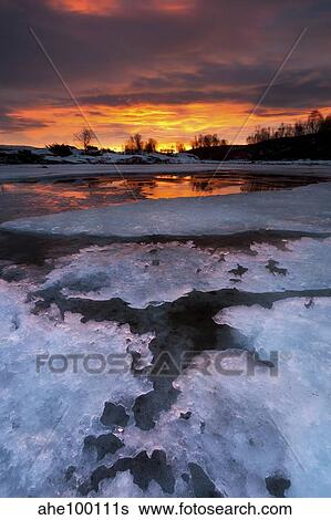A fiery sunrise over Lavangsfjord, Troms, Norway. View Large Photo Image Stock Photograph - A fiery sunrise over Lavangsfjord, Troms, Norway.. Fotosearch