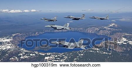 A five ship aircraft formation flies over Crater Lake, Oregon. View Large Photo Image Picture - A five ship aircraft formation flies over Crater Lake, Oregon.. Fotosearch