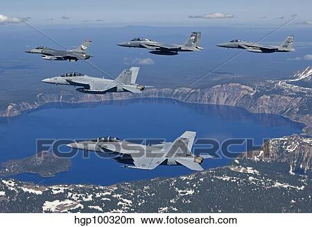 A five ship aircraft formation flies over Crater Lake, Oregon. View Large Photo Image Picture - A five ship aircraft formation flies over Crater Lake, Oregon.. Fotosearch