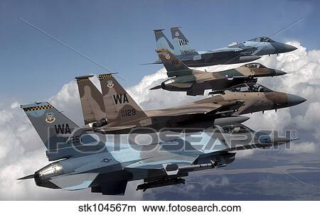 A flight of Aggressor F-15 and F-16 aircraft fly in formation. View Large Photo Image Picture - A flight of Aggressor F-15 and F-16 aircraft fly in formation.. Fotosearch