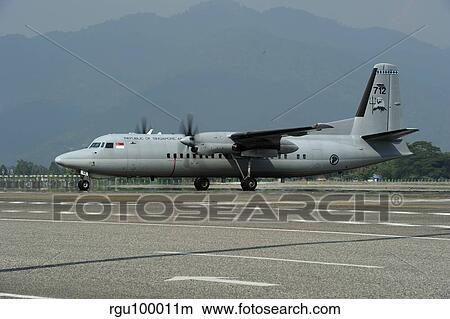 A Fokker F-27 Friendship of the Singapore Air Force at Langkawi Airport. View Large Photo Image Picture - A Fokker F-27 Friendship of the Singapore Air Force at Langkawi Airport.. Fotosearch