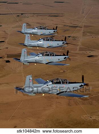 A formation of Iraqi Air Force T-6 Texan trainer aircraft over Tikrit, Iraq. View Large Photo Image Picture - A formation of Iraqi Air Force T-6 Texan trainer aircraft over Tikrit, Iraq.. Fotosearch