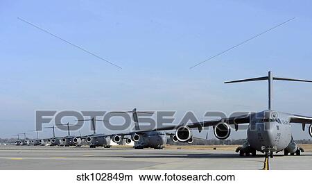 A Formation of U. S. Air Force C-17 Globemaster III's prepare for departure. View Large Photo Image Picture - A Formation of U. S. Air Force C-17 Globemaster III's prepare for departure.. Fotosearch