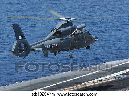 Picture - A French Dolphin 35F helicopter takes off from the flight deck of USS John C. Stennis.. Fotosearch