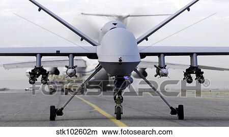 A fully armed MQ-9 Reaper taxis down an Afghanistan runway. View Large Photo Image Picture - A fully armed MQ-9 Reaper taxis down an Afghanistan runway.. Fotosearch