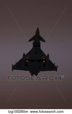 A German Air Force Eurofighter Typhoon approaching at sunset. View Large Photo Image Picture - A German Air Force Eurofighter Typhoon approaching at sunset.. Fotosearch