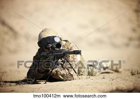 A German soldier sights in a Barrett M82A1 rifle. View Large Photo Image Picture - A German soldier sights in a Barrett M82A1 rifle.. Fotosearch