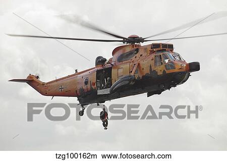 A German WS-1 Sea King during a fast-roping exercise. View Large Photo Image Picture - A German WS-1 Sea King during a fast-roping exercise.. Fotosearch