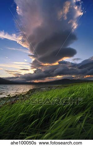 Stock Photograph - A giant stacked lenticular cloud over Tjeldsundet, Troms County, Norway.. Fotosearch