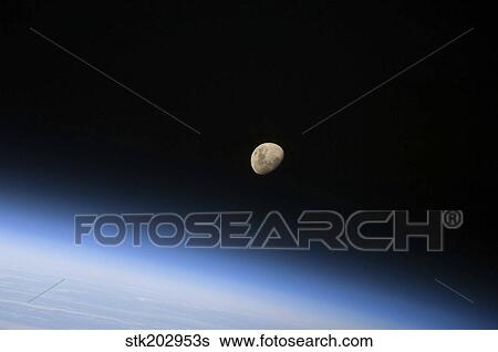 A gibbous moon visible above Earth's atmosphere. View Large Photo Image Stock Photograph - A gibbous moon visible above Earth's atmosphere.. Fotosearch