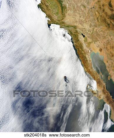 Stock Photograph - A glory is seen above a layer of stratocumulus clouds over the Pacific Ocean.. Fotosearch