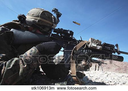 A grenadier provides suppressing fire during counter-ambush training. View Large Photo Image Picture - A grenadier provides suppressing fire during counter-ambush training.. Fotosearch