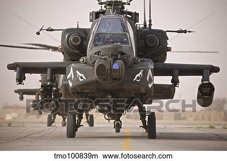 A group of AH-64D Apache helicopters on the runway at COB Speicher. View Large Photo Image Picture - A group of AH-64D Apache helicopters on the runway at COB Speicher.. Fotosearch