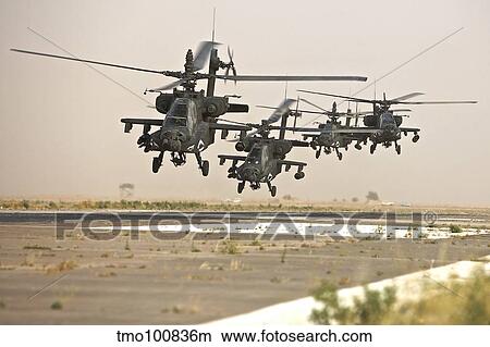 A group of AH-64D Apache helicopters landing on the runway. View Large Photo Image Picture - A group of AH-64D Apache helicopters landing on the runway.. Fotosearch